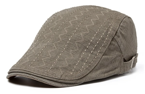 Detail of grey textured cotton beret cap featuring stylish Z-shaped decorative stitching