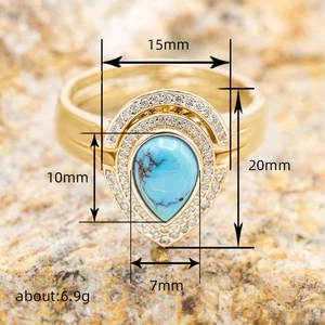 Bohemian pear-shaped turquoise ring with gold finish and double halo of white stones