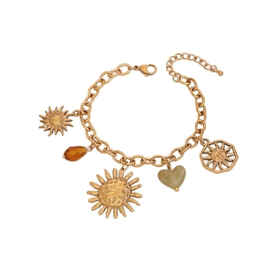 Gold sun charm bracelet with heart and gemstone drops on white background