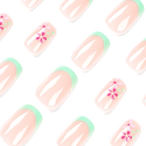 French tip press-on nails with mint green edges and pink flower patterns on square nails