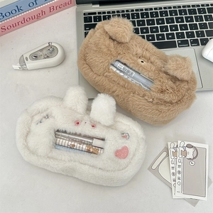 Detailed view of plush cat and dog pencil cases with transparent windows and stationery