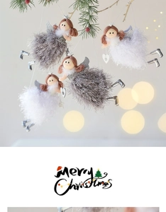 Detail of plush Christmas angel ornaments with silver crowns hanging on a pine branch