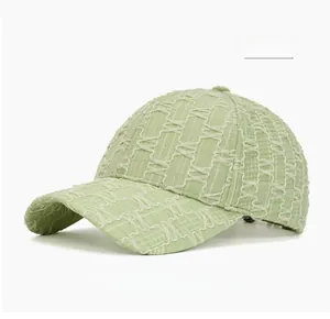 Detail of light green baseball cap featuring unique seersucker textured fabric surface