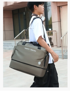 Outdoor lifestyle shot of a large army green dry wet separated fitness travel bag
