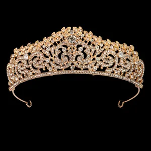 Detail of a bridal crown with gold plating and white rhinestones in vintage leaf design