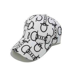 Detail of white baseball cap featuring black horseshoe pattern and curved brim