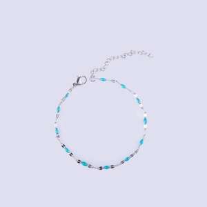 Detail of silver stainless steel lip chain with sky blue enamel charms and lobster clasp