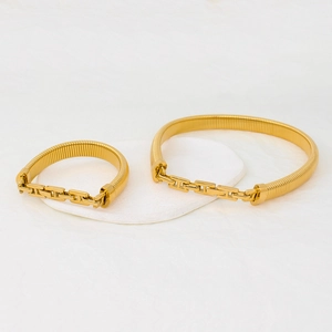 Modern gold snake bone choker and bracelet set with minimalist metallic finish