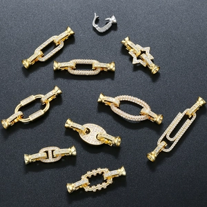 Macro detail of geometric jewelry clasps with micro-pave cubic zirconia accents
