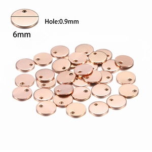 Detailed view of 6mm rose gold stainless steel round tags with 0.9mm hole for DIY jewelry