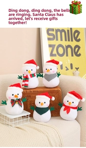 Detailed view of plush Christmas snowmen set with festive scarves and red holiday hats