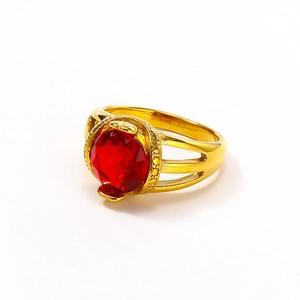 Detail of 18K gold-plated ring featuring a vibrant red round zircon in a hollow setting