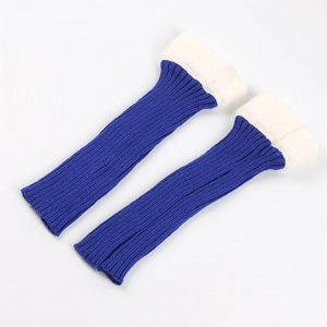 Detailed view of blue knitted leg warmers with soft white faux fur trim cuffs