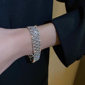 Macro side view of silver layered rhinestone bracelet with micro-pave setting