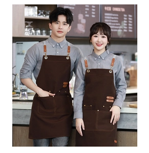 Waterproof canvas apron in brown with leather straps and multi-pockets for cafe work