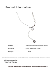 Detail view of silver tassel necklace with irregular silver pieces and imitation pearl