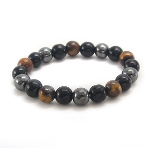 Detailed view of beaded bracelet with obsidian, tiger eye, and hematite round stones
