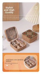 Detail view of cork mini jewelry box with vintage geometric patterns and interior slots