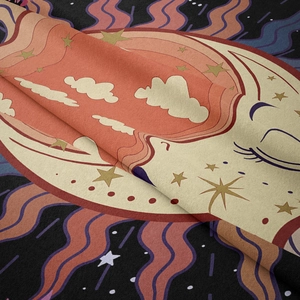 Close-up of soft bohemian sun and moon tapestry fabric showing texture and thickness