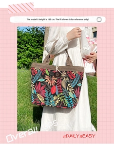 Detail of tropical leaf print tote bag with vintage wood button and corduroy trim