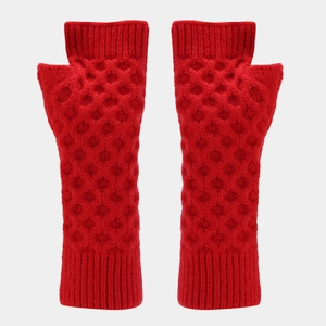 Detail of red knitted arm warmers with a honeycomb pattern and fingerless design