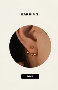 Detailed close-up of gold beaded hoop earrings style F442 with polished metallic finish