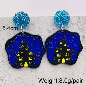 Halloween earrings featuring black castle and bat silhouette with blue glitter studs