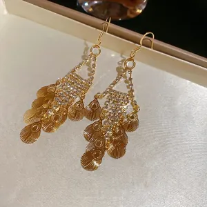 Elegant gold leaf tassel drop earrings with sparkling rhinestones in a vintage style