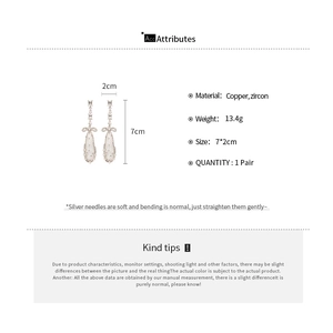 Detail showing dimensions and material of silver needle zircon teardrop bow earrings