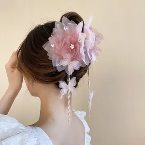 Pink mesh flower hair claw with rhinestone butterflies and long tassel fringe