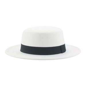 Detail shot of a white wool boater hat for kids featuring a classic black ribbon band