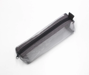 Detail of grey mesh pencil case showing fine nylon texture and black zipper puller