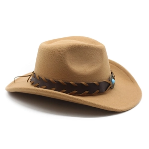 Detail of tan wool felt cowboy hat with braided leather band and turquoise bead accent