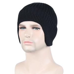 Close-up of black ribbed knit beanie with ear protection on a mannequin head