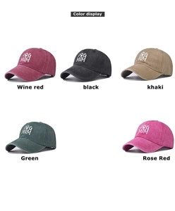 Multiple colors of washed denim dog mama baseball caps with white embroidered lettering
