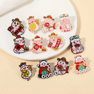 Detail view of colorful cartoon snake enamel pins set with Chinese New Year festive charms