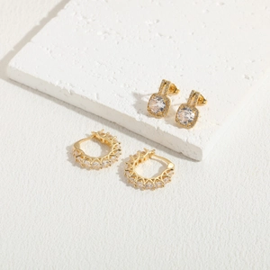 Luxury 14K gold plated zircon stud and hoop earrings set on minimalist stone background
