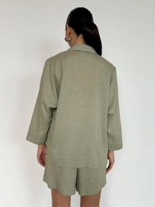 Sage green linen suit set showing back view of loose blazer and high waist shorts