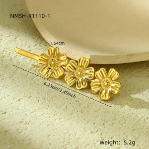 Detail view of gold flower hair clip with dimensions 6.23cm length and 1.64cm petal height