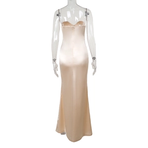 Detail view of champagne satin dress with slim fit tailoring and rear zipper closure