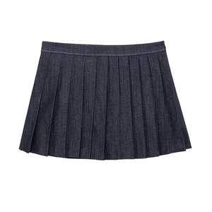 Detail of dark blue denim pleated skirt featuring white contrast stitching on the waist