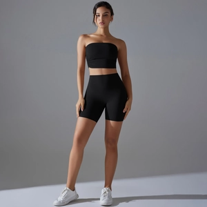Full view of black two-piece yoga set with bandeau top and high waist sports shorts