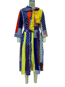 Detail of color-block dress showing bowtie neckline and vibrant geometric patterns