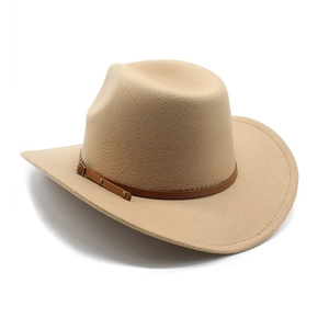 Detail of camel western cowboy hat with brown leather band and metal buckle on felt