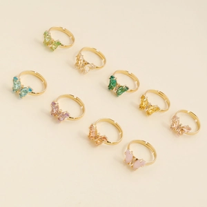 Détails de bagues papillon en zircon coloré avec anneaux dorés réglables