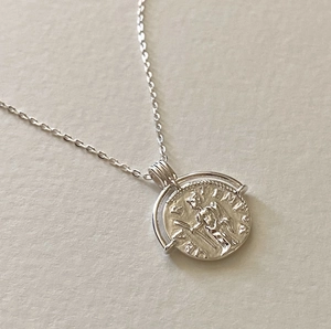 Vintage 925 sterling silver oval coin necklace featuring embossed portrait pendant