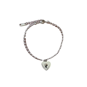Polished stainless steel bead chain bracelet with heart queen coin pendant on white background
