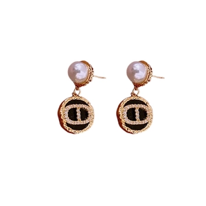 French vintage earrings with gold-plated pearls and black CD logo zircon detailing