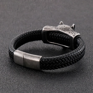Men's braided black leather bracelet with antique silver wolf head magnetic clasp