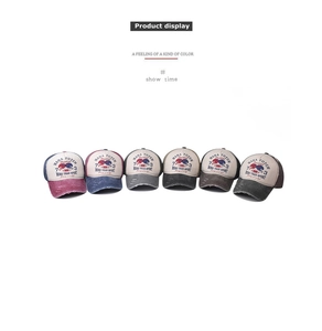 Detail view of distressed cotton baseball caps in six vintage color combinations